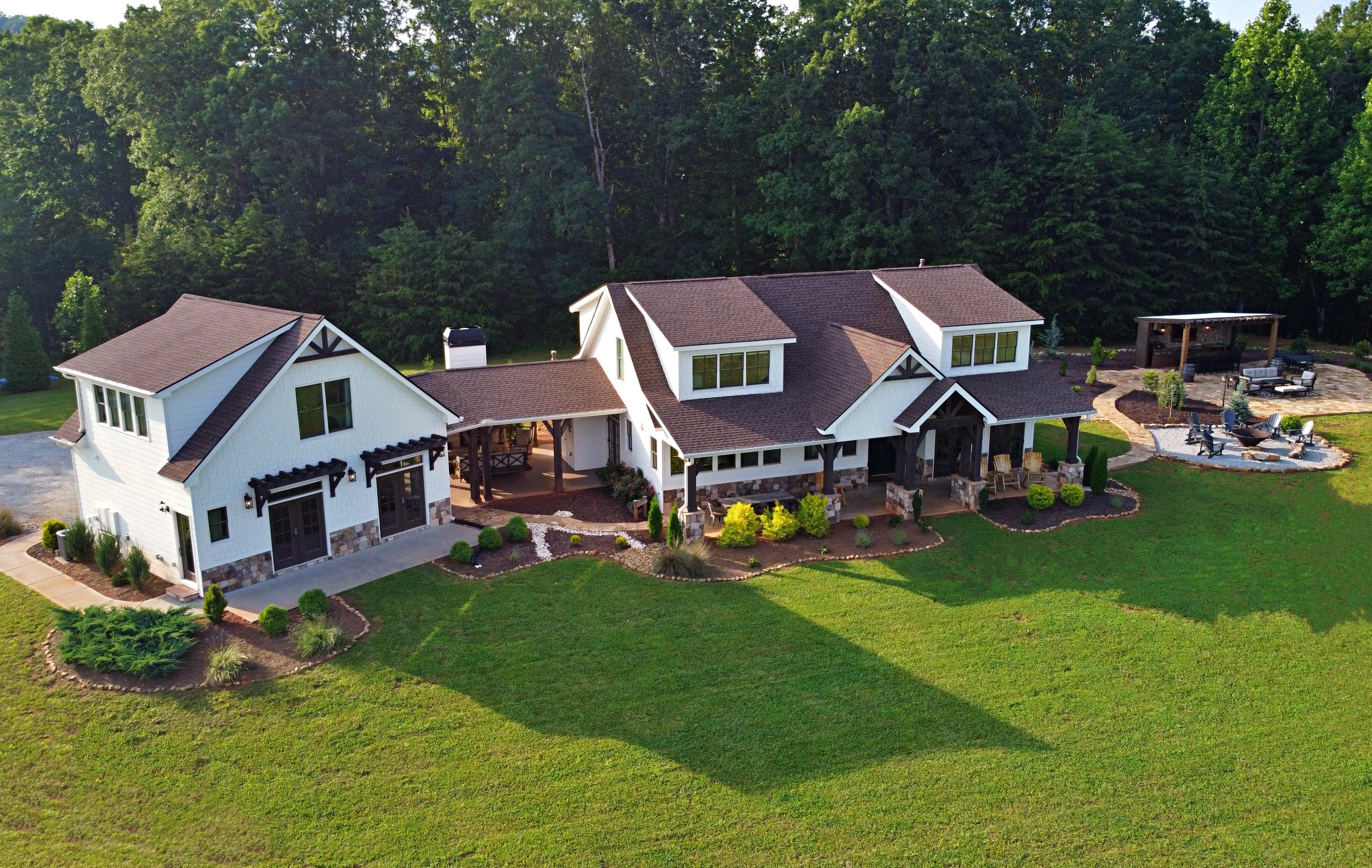 White farmhouse with main house and carriage house connected by a breezeway