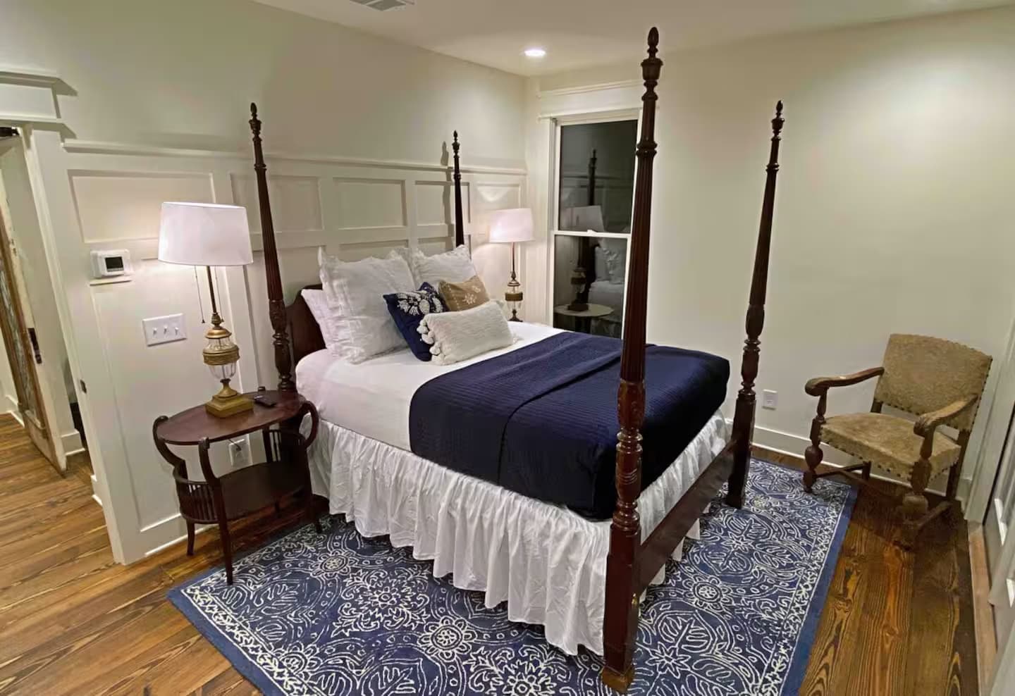 Queen bedroom with white and navy blue decor